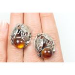 Pair of Arts and Crafts style white metal and amber earrings,