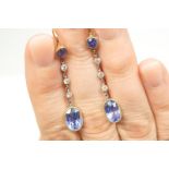 Pair of blue stone and diamond pendant earrings,