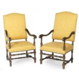 Pair of walnut and upholstered open armchairs in the William and Mary style,