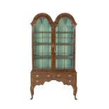 Walnut double dome topped display cabinet on stand, late 19th Century in Queen Anne style,