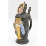 Continental coloured bisque novelty jug, circa 1890, modelled as a friar holding a bunch of turnips,