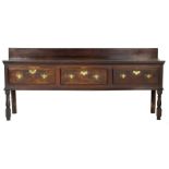 George II oak low dresser, circa 1730, fitted with three drawers with later brass handles,