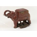 Indian painted cast iron novelty cigarette dispenser, formed as an elephant, complete with ashtray,