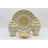 Four pieces of Poole studio pottery, all decorated in a banded design of waves,