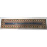 Afghan woollen runner, with blue abrashed field in a fawn border, with blue and red guls,