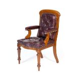 Late Victorian mahogany and burgundy leather upholstered open armchair, circa 1890, pad back,