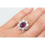 Fine ruby and diamond cluster ring by Boodle and Dunthorne,