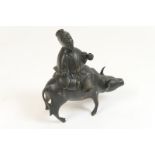 Tibetan bronze incense burner, 19th Century, cast as a figure riding an ox, 13.