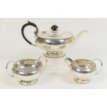 George V silver three piece tea service by Walker and Hall, Sheffield 1929, comprising teapot,