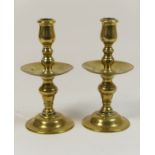 Pair of Flemish brass candlesticks in 17th Century style, with multi-knopped columns and drip tray,