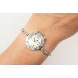 Lady's Swiss platinum and diamond cocktail watch, 15mm dial with Arabic numerals,