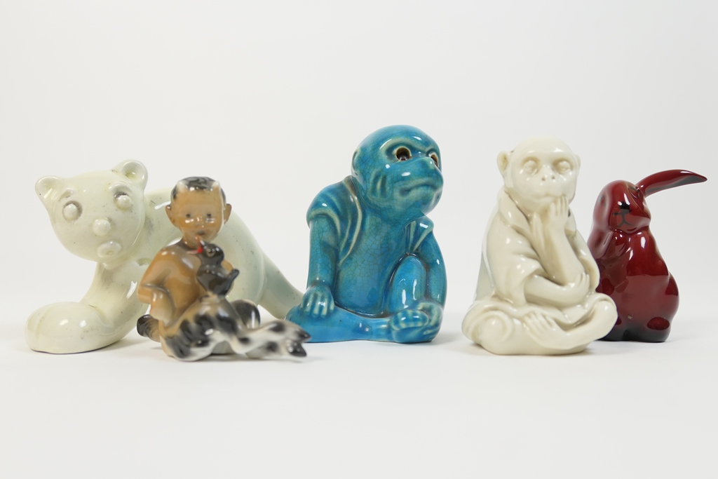 Small group of five pottery figures including a Royal Doulton flambe rabbit,