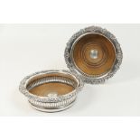 Pair of Victorian silver plated wine coasters, circa 1870, gadrooned and shell scroll borders,