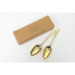 Pair of George III silver gilt table spoons, maker W.C, London 1773, weight approx. 129g (4.