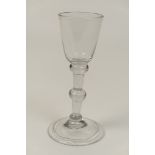 George II wine glass, circa 1750, U-shaped bowl, triple knopped stem over a conical folded foot,