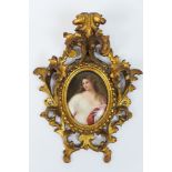 Vienna style hand decorated porcelain plaque featuring a young woman with long brown hair, oval,