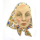 Lenci pottery wall mask, modelled as a beautiful girl in a coloured head scarf,