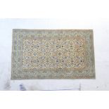 Kashan woollen rug, busy fawn field evenly distributed with flowerheads in colours,