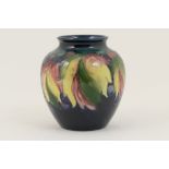 William Moorcroft Leaf and Berries vase, baluster form with slightly everted neck,