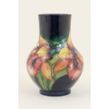 Moorcroft Orchid vase, baluster form with cylinder neck, deep cobalt blue ground, impressed marks,