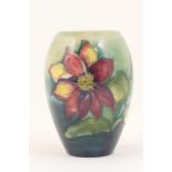 Moorcroft Clematis vase, ovoid form with a shaded blue green ground,