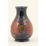 Moorcroft Pomegranate small vase, baluster form with deep cobalt blue ground,