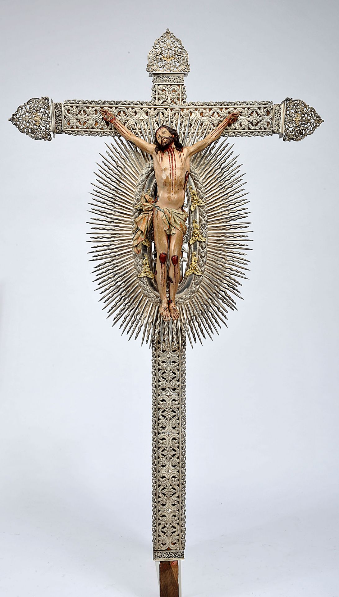 A Crucifix, chiselled and pierced silver lined wooden cross with gilt bronze applications en