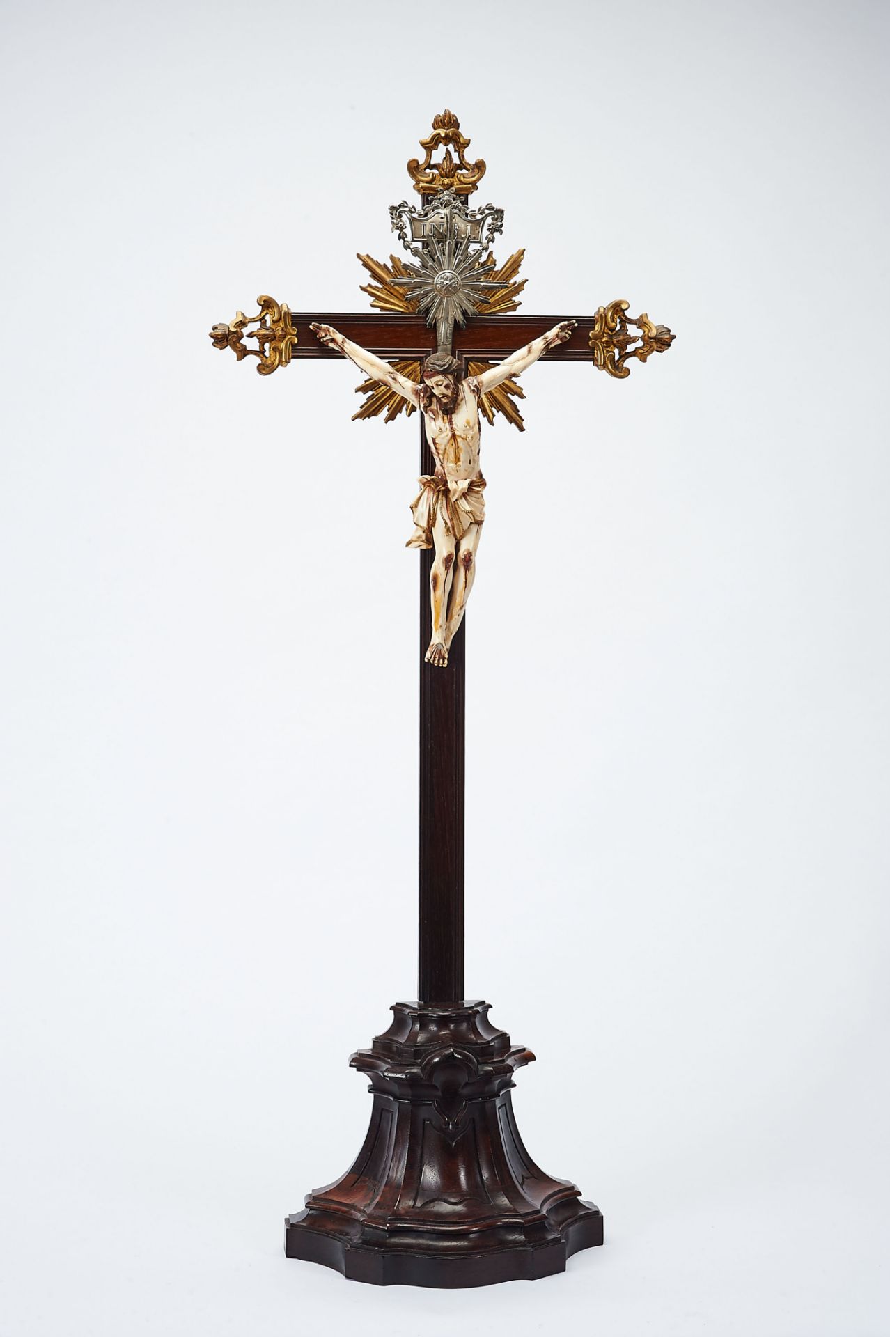 Crucified Christ, partly painted and gilt ivory sculpture, Brazilian rosewood stand and cross with
