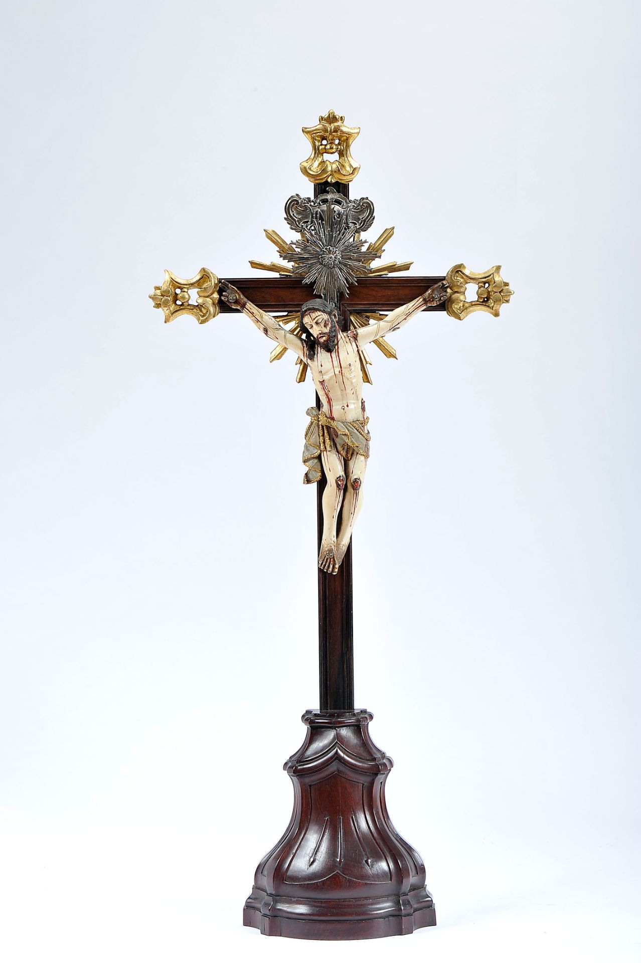 Crucified Christ, painted and gilt ivory sculpture, Brazilian rosewood stand and cross with gilt