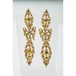 A Pair of Earrings, pierced gold set with rose cut diamonds, elliptical upper element, central