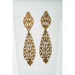 A Pair of Earrings, pierced gold set with rose cut diamonds, elliptical upper element and pear-