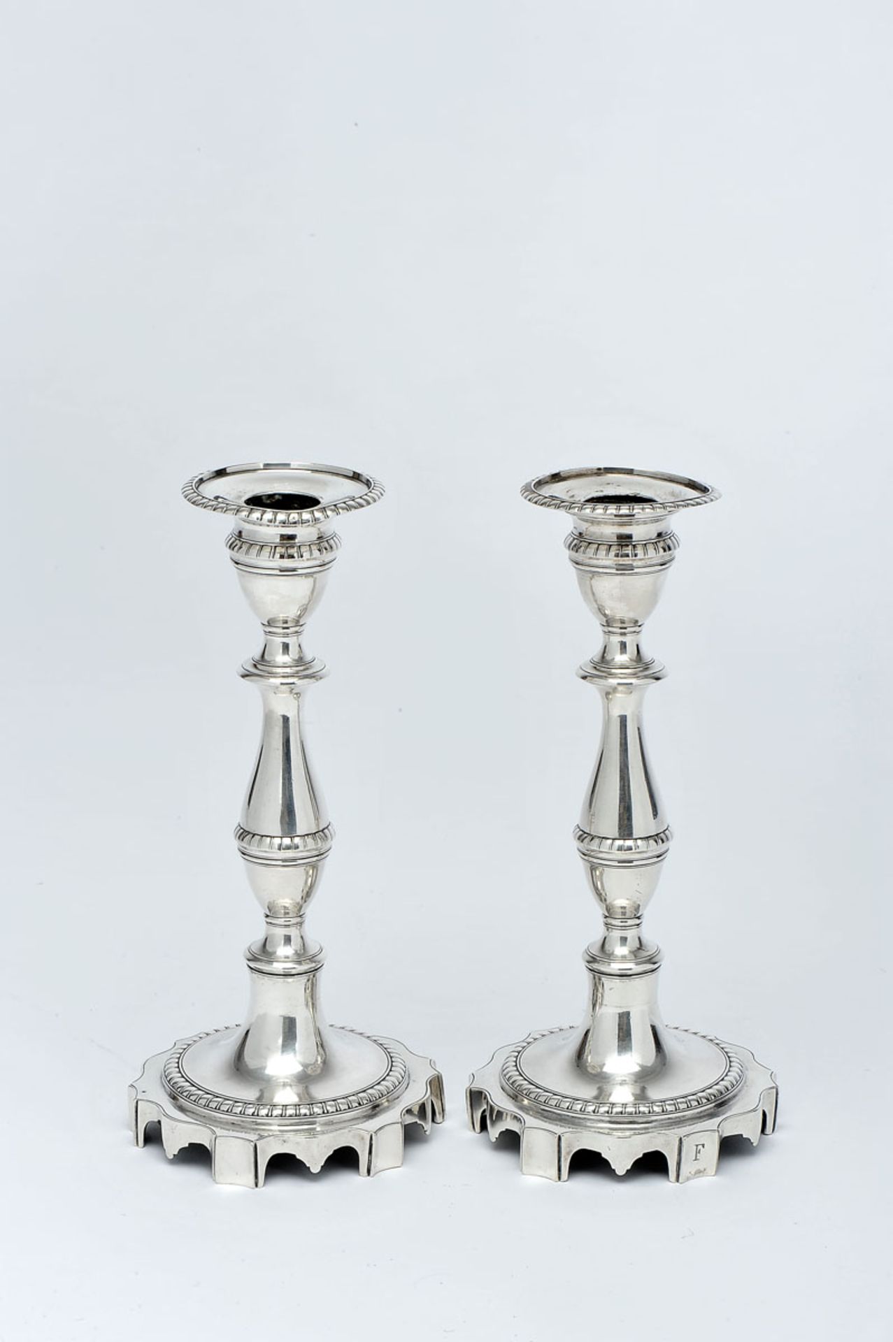 A Pair of Candlesticks with scalloped round base, D. Maria I, Queen of Portugal (1777-1816), 833/