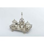 An Inkstand, 833/1000 silver, stand with gallery and four zoomorphic feet, comprising container with