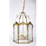 A Four-light Hexagonal Suspension Lantern, Louis XV style, gilt bronze, chiselled decoration en