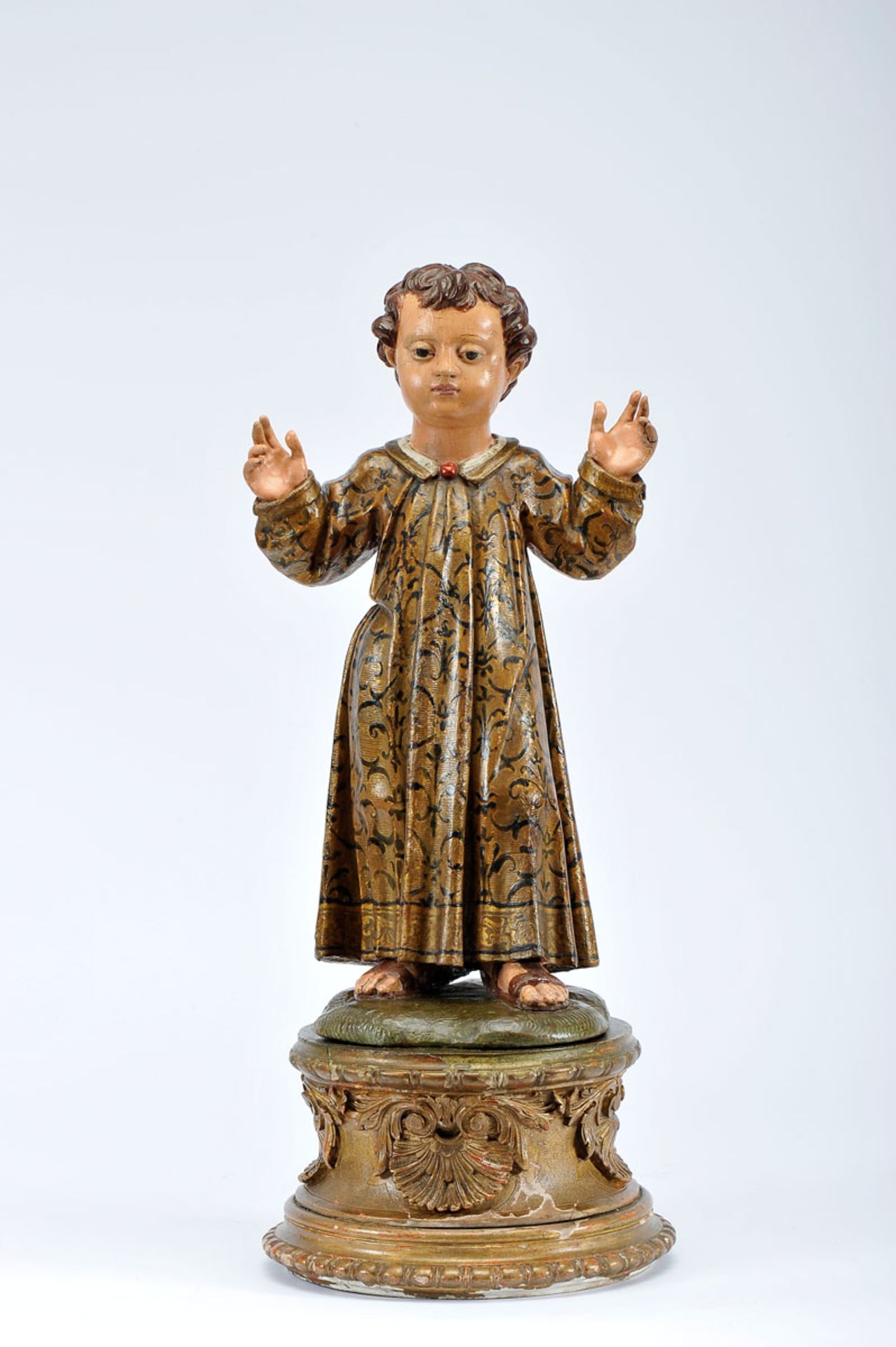 The Child Jesus, polychrome and gilt wooden sculpture, gilt wooden base en relief with shell motifs,