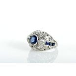 A Ring, platinum 500/1000, set with six calibrated sapphires, one round cut with approximate