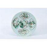 A Large Dish, Chinese porcelain, reserves with «famille verte» decoration "Oriental landscape,