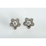 A Pair of Earrings "Flower", platinum, set with 8/8 cut diamonds and 2 brilliant cut with the