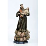 St. Anthony with the Child Jesus and a bag of bread, polychrome wooden carving, glass eyes,