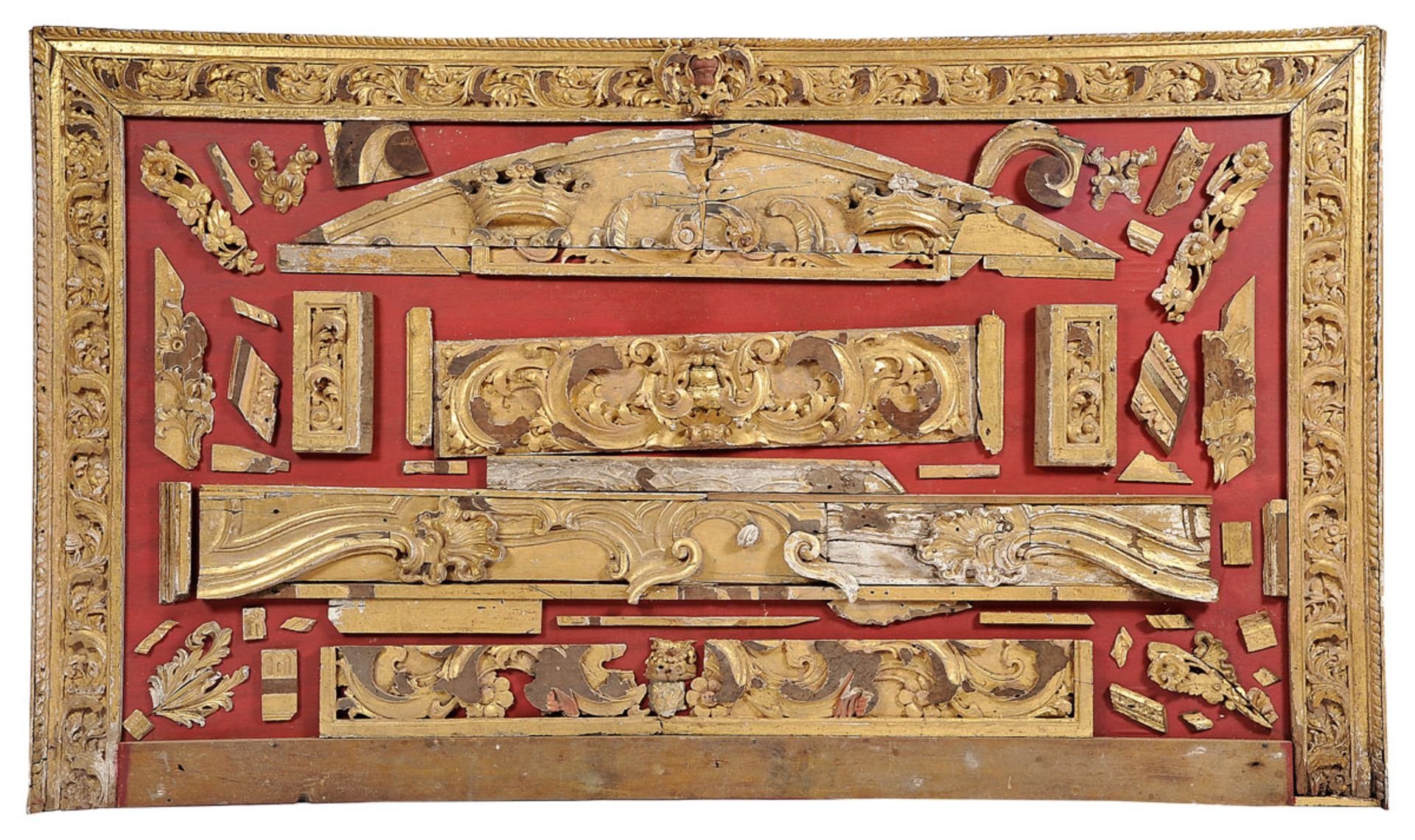 A composition of carving elements, carved and gilt wood, Portuguese, 18th C., faults, traces of wood