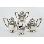 A Tea and Coffee Set, 833/1000 silver, beaded and engraved decoration en relief "Vegetal