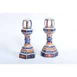 A Pair of Hexagonal Candlesticks, Japanese porcelain, blue, «Rouge-de-fer» and gilt «Imari»,