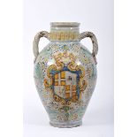 A Large Vase with two Handles, faience probably from Talavera, polychrome decoration with the coat