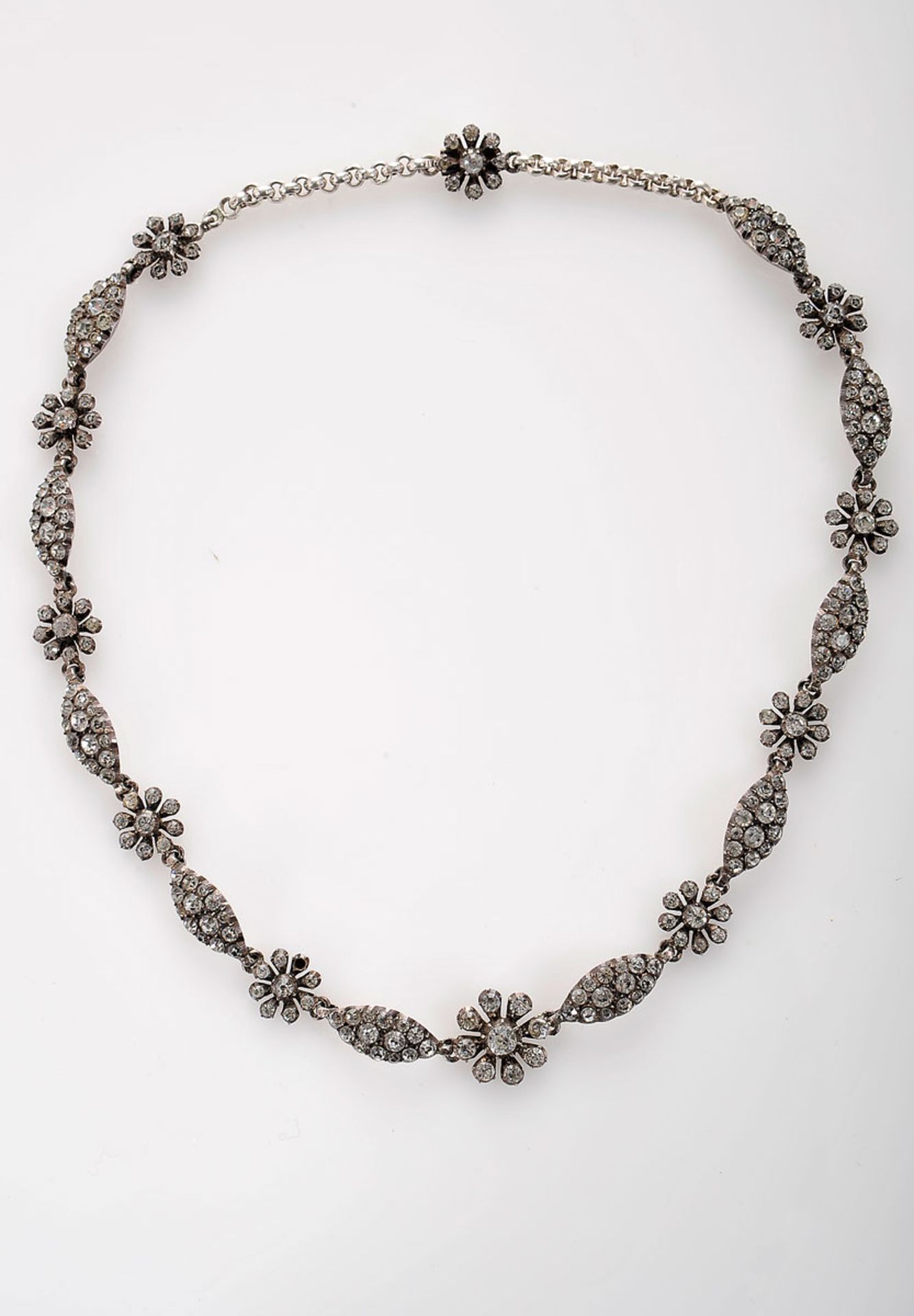 A Necklace, silver, set with rhinestone, Portuguese, 19th/20th C., with case, lacking 1