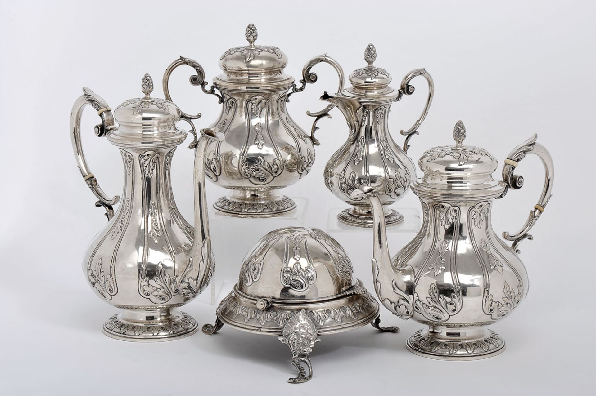 A Tea and Coffee Set, 833/1000 silver, decoration en relief, consisting of a teapot, a coffee pot, a