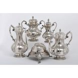 A Tea and Coffee Set, 833/1000 silver, decoration en relief, consisting of a teapot, a coffee pot, a