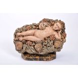 The Child Jesus lying down, terracotta sculpture, polychrome decoration, Portuguese, 18th C.,