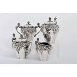 A Tea and Coffee Set, neomanueline style, 833/1000 silver, engraved and embossed decoration "