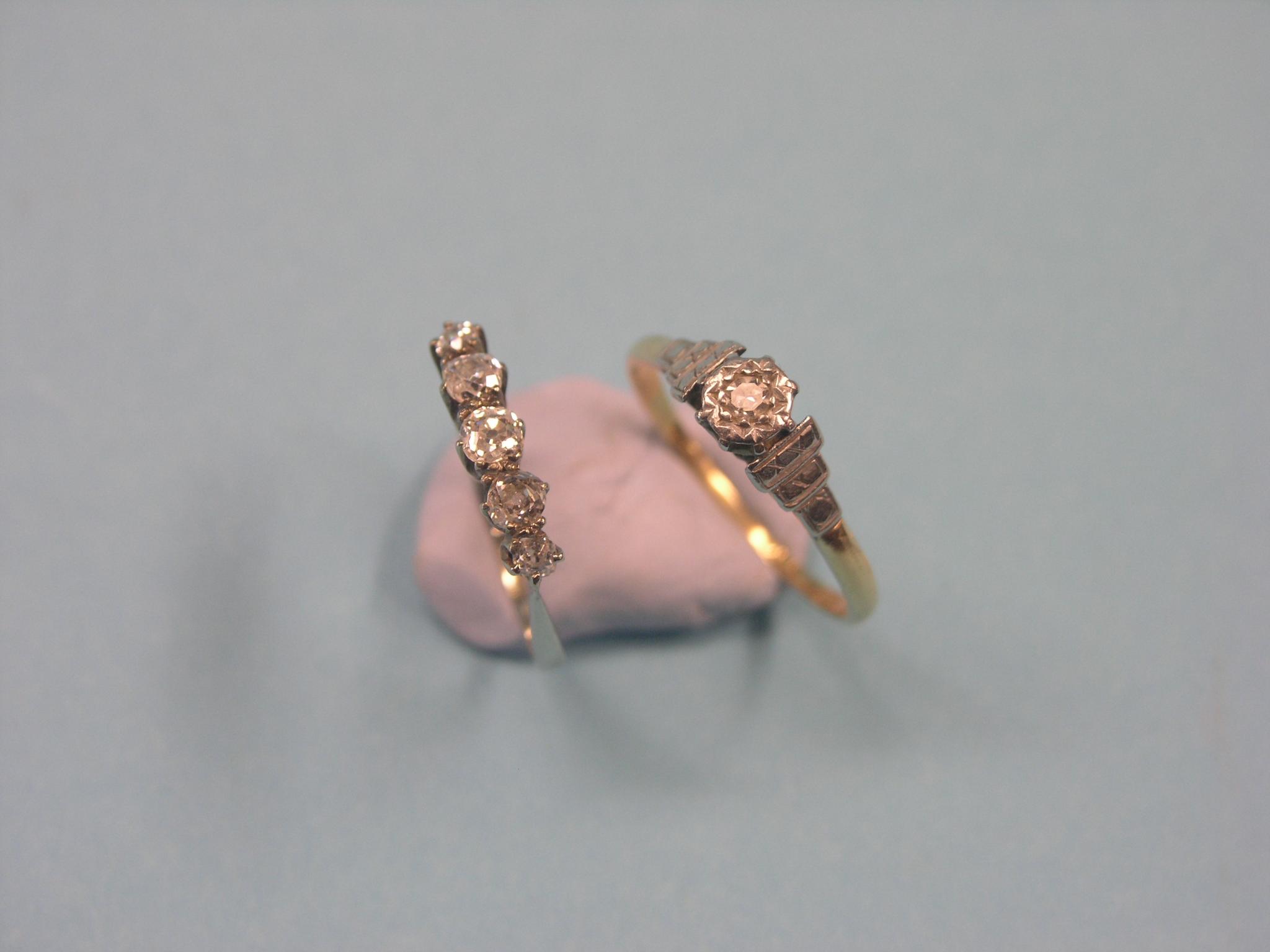 A diamond half-hoop ring, five graduated stones, claw settings