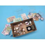 An assortment of coins and banknotes